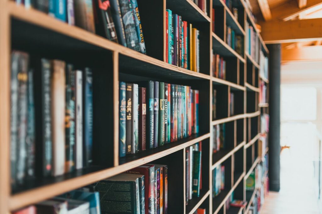 pexels photo 8045884 Colorful books neatly arranged on modern shelves in a bright library.